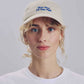 Cappellino beige ricamato “More Wine S’il Vous Plaît”
