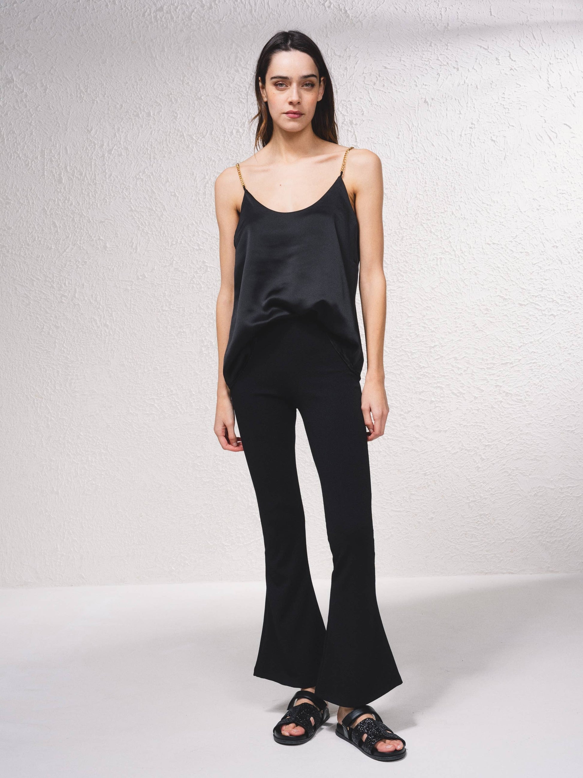 Pantaloni a zampa in rete con vita elasticizzata
