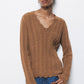 Maglione in lana a trecce con scollo a V