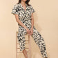 Tuta floreale con scollo a V e cintura