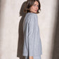 Completo in maglia scintillante due pezzi con gonna midi