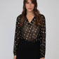 Blusa Souella nera in tessuto velato con paillettes multicolor