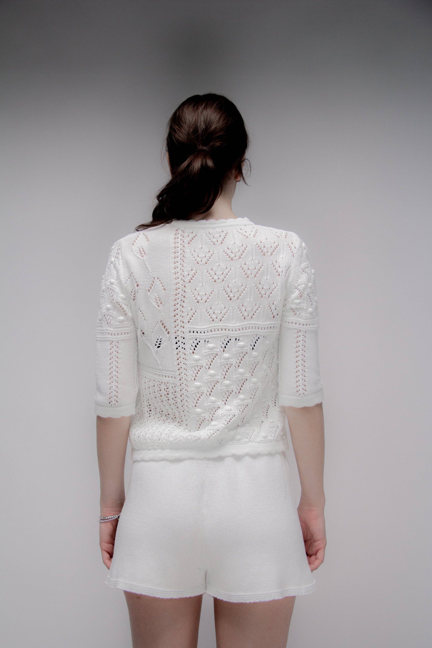 Maglia traforata in cotone con motivo floreale