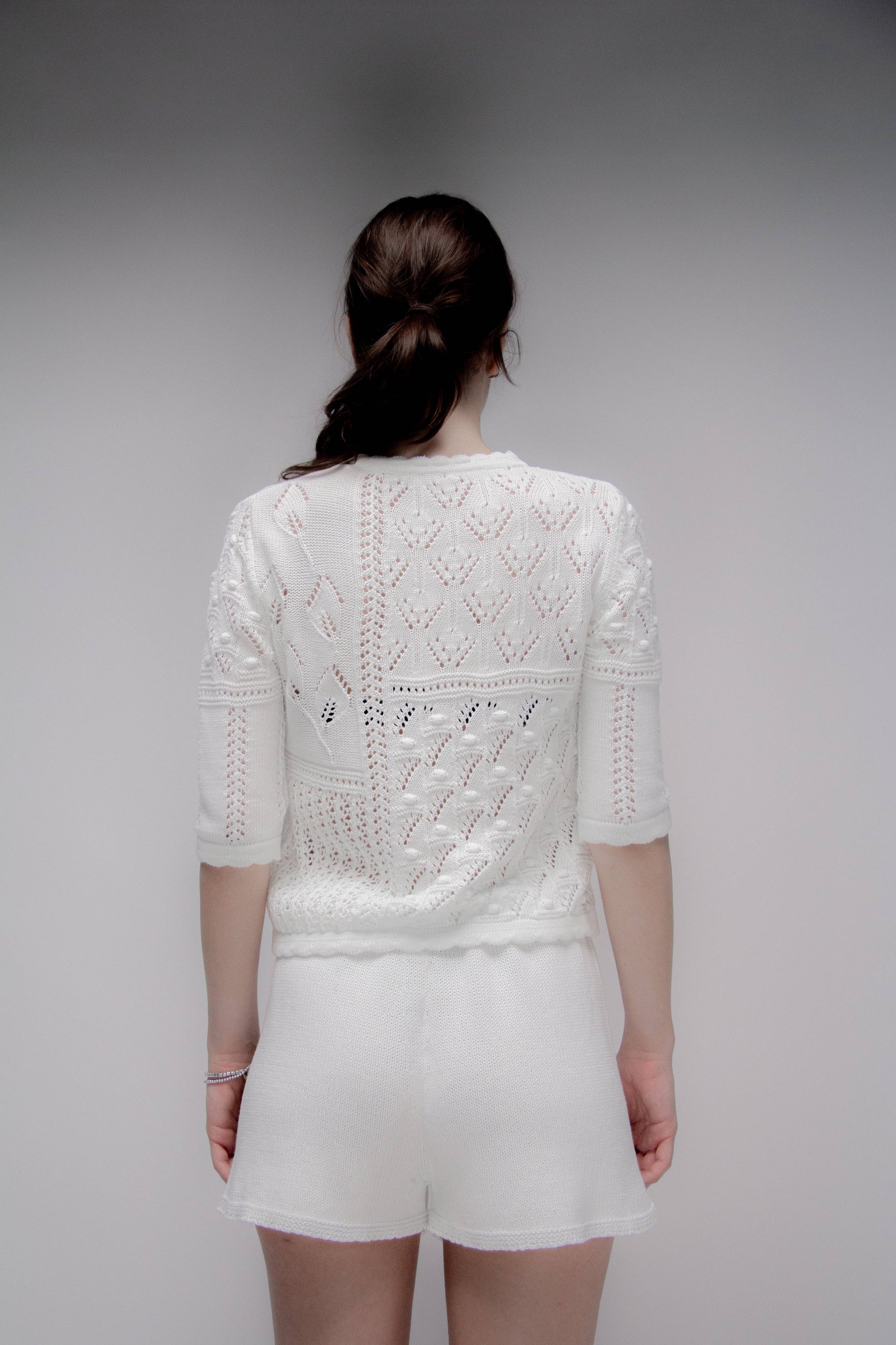 Maglia traforata in cotone con motivo floreale