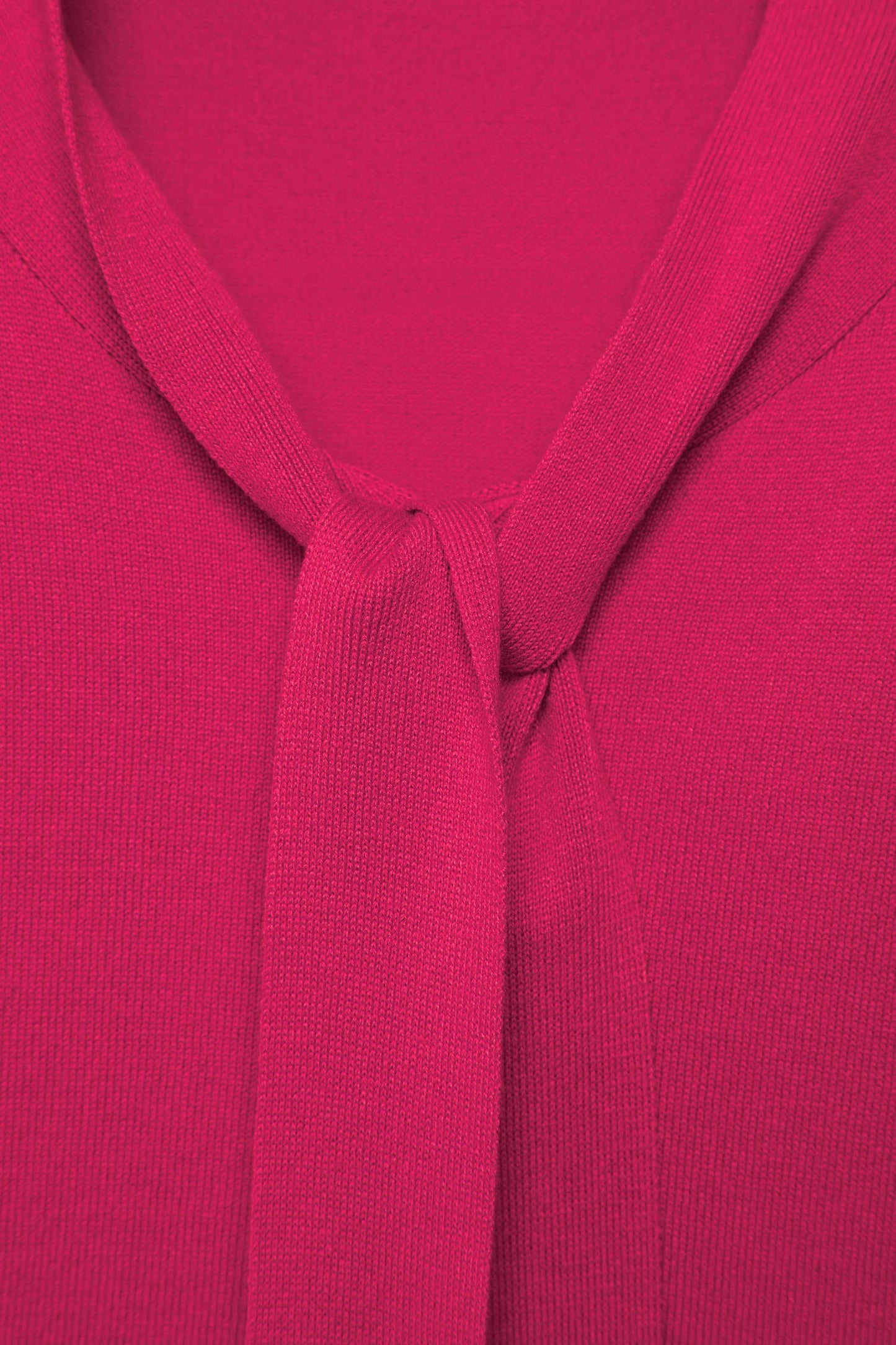 Maglione in maglia rasata con fiocco e scollo a V