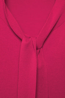 Maglione in maglia rasata con fiocco e scollo a V