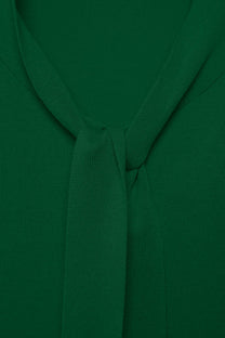 Maglione a maglia rasata con scollo a V e fiocco