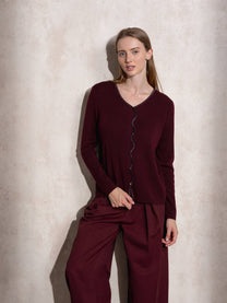 Maglione in maglia scintillante con profilo ondulato