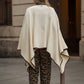 Poncho in lana con bordatura a contrasto