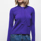 Maglione in maglia rasata con fiocco e scollo a V