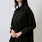 Camicia nera oversize con cinturini e bottoni in metallo