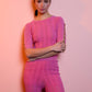 Top in maglia lurex con dettagli ad anelli
