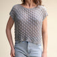 Top corto in crochet traforato dal fit ampio
