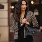 Cardigan animalier in maglia con bordi neri