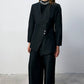 Completo donna nero con blazer asimmetrico e pantaloni a gamba larga