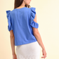 T-shirt con volant “Good Things Are Coming”