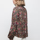 Blusa floreale con laccio al collo