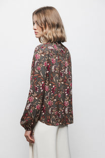 Blusa floreale con laccio al collo