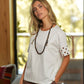 T-shirt in cotone con maniche ricamate