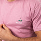 T-shirt rosa in cotone biologico con stampa surfer