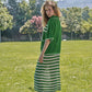 Completo in maglia traforata a righe con giacca e gonna