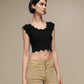 Top crop in maglia a costine con bordo ondulato