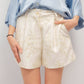 Shorts in raso con ricamo floreale