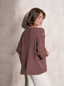 Maglia ampia in maglia con bottoni sulle maniche