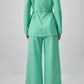 Completo in crepe verde menta con tunica plissettata e pantaloni a gamba larga