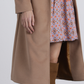 Cappotto lungo con cintura e occhielli