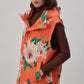 Gilet imbottito con cappuccio floreale arancione