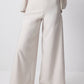 Completo smanicato con gilet cintura e pantaloni palazzo