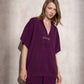 Cappa in maglia con fibbia decorativa