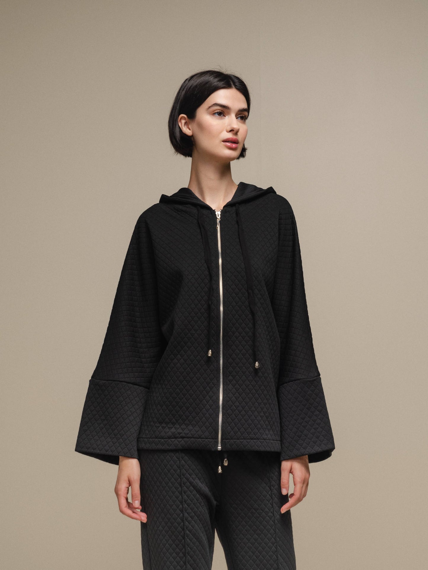 Cappotto donna trapuntato con cappuccio e zip