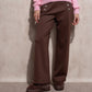 Pantaloni a palazzo a vita alta con bottoni decorativi