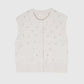 Cardigan smanicato in maglia écru con perle
