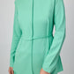 Completo in crepe verde menta con tunica plissettata e pantaloni a gamba larga