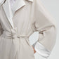 Trench oversize con maniche raglan e cintura