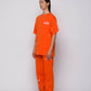T-shirt arancione con logo