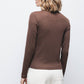 Maglione in maglia con dettagli metallici e collo alto