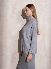 Maglione in maglia con motivo a pois e bottoni ai polsi
