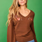 Maglione con scollo a V ricamato beige