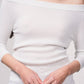 Maglione lurex off-shoulder