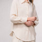 Camicetta oversize con bottoni frontali e colletto classico
