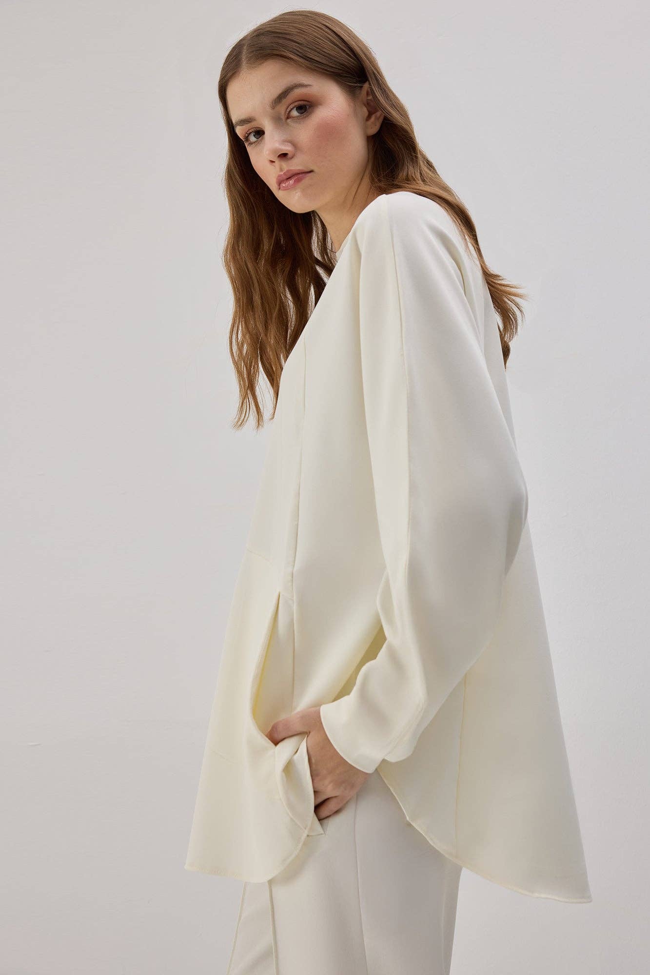 Tunica in crêpe con tasche