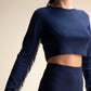 Top corto in maglia con frange sulle maniche