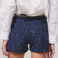 Shorts effetto tweed con catena