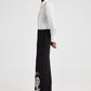 Pantaloni in crêpe neri con ricami