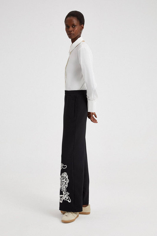 Pantaloni in crêpe neri con ricami