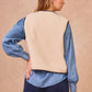 Gilet in ecopelliccia con profili intrecciati blu